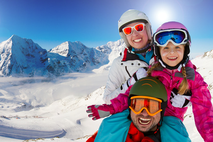 Skiing, winter fun - happy family ski team